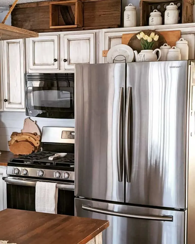 24 Genius Top of Fridge Decor Ideas You'll Love 57 24 Genius Top of Fridge Decor Ideas You'll Love Fridge Top Decor with White and Wood 768x960 1 Top of Fridge Decor Ideas